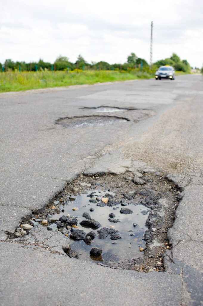 asphalt paving damage and pavement failure on a road